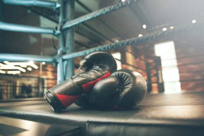 Boxing,Glove,On,Boxing,Ring,In,Gym